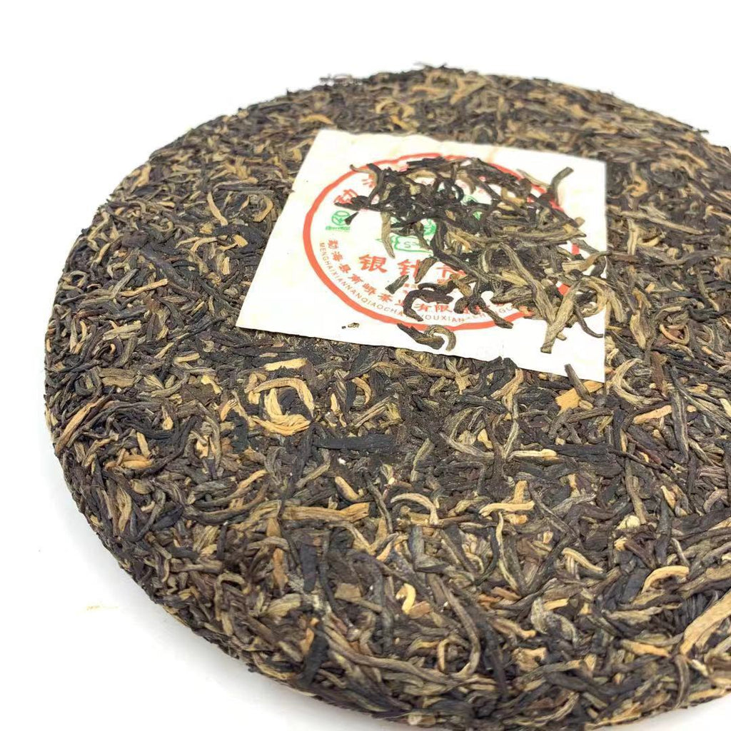 2006 Nanqiao Menghai Arbor Wild Tea Silver Needle Tribute Cake Raw Pu'er 250g