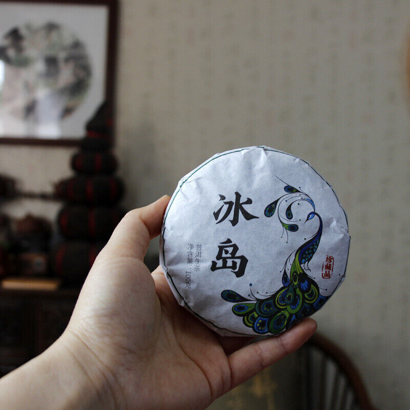 HelloYoung 100g Yunnan Pu'er tea Icelandic raw peacock green cake seven cakes Mengku tea