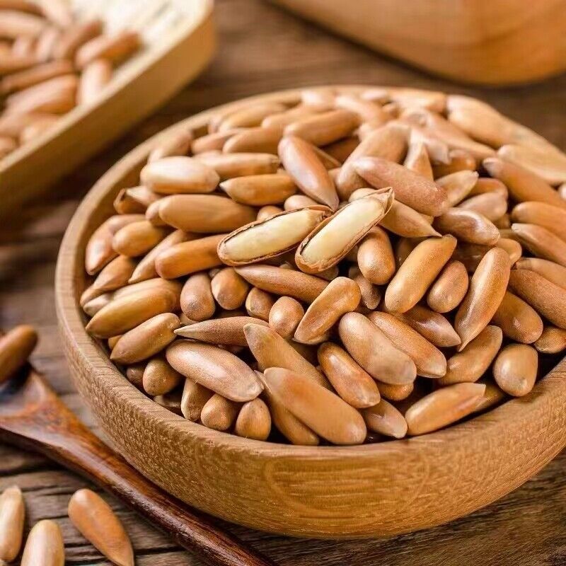 Hand-peeled pine nuts New Brazilian pine nuts Long grain large granular snack