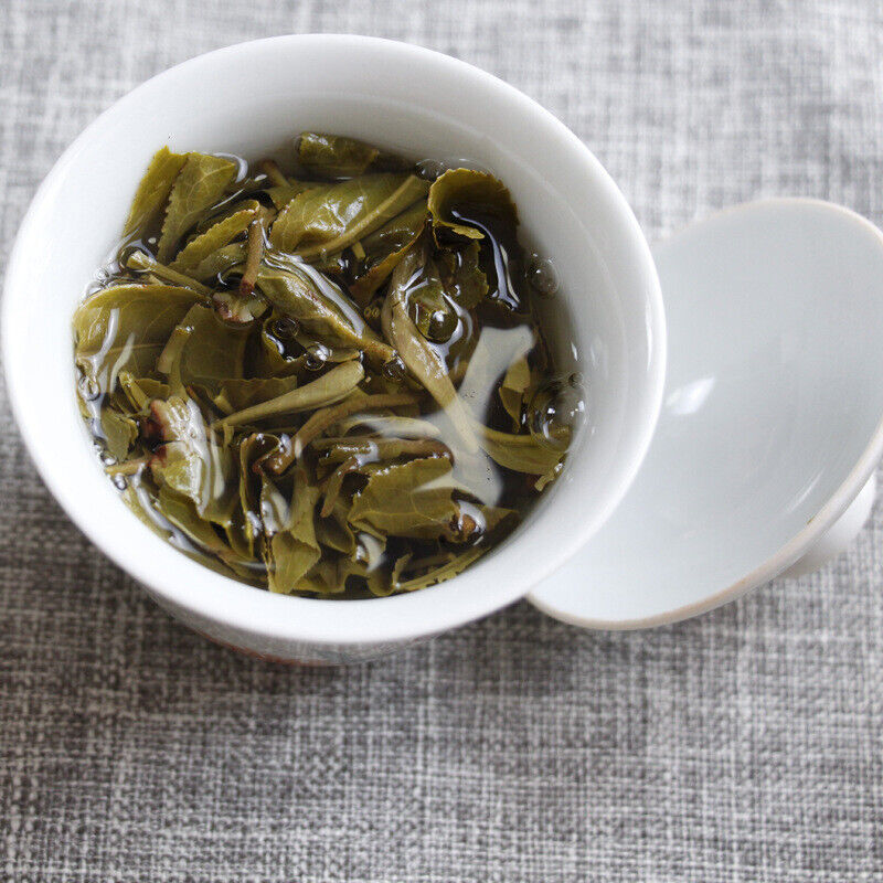HelloYoung 100g Yunnan Pu'er tea Icelandic raw peacock green cake seven cakes Mengku tea