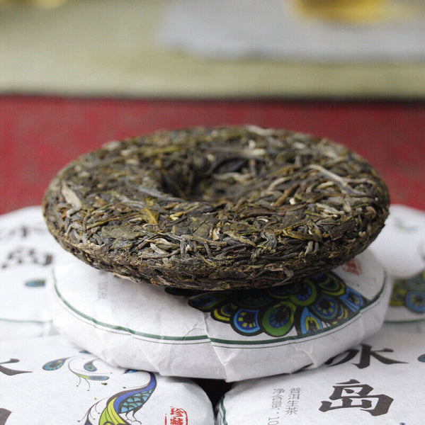 HelloYoung 100g Yunnan Pu'er tea Icelandic raw peacock green cake seven cakes Mengku tea