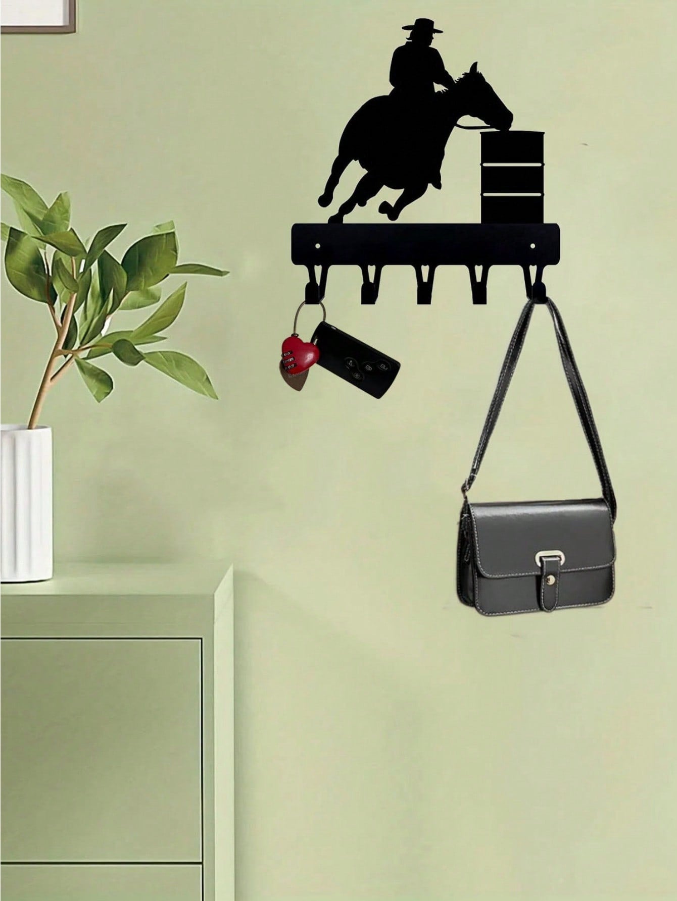 A black metal home decoration riding character shape hook can be hung in bedrooms, living rooms, offices and other places, with a beautiful meaning. It can be used as a personalized gift and is also suitable for kitchen storage.