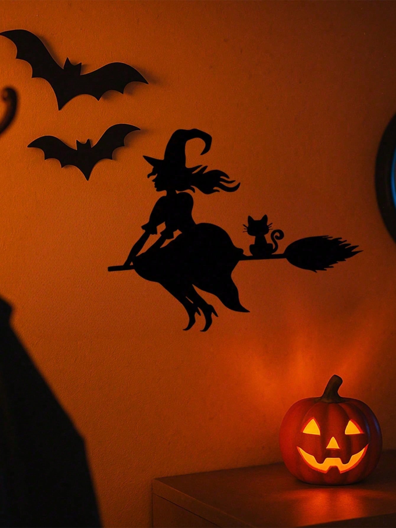 Midnight Witch Wall Art: An intricately crafted iron silhouette of a witch soaring on a broomstick under the moonlight. This Halloween-themed black metal wall ornament features delicate butterfly accents, adding a mystical charm to your space. Perfect as