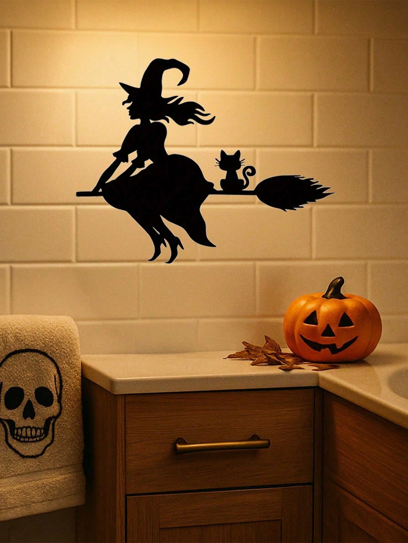Midnight Witch Wall Art: An intricately crafted iron silhouette of a witch soaring on a broomstick under the moonlight. This Halloween-themed black metal wall ornament features delicate butterfly accents, adding a mystical charm to your space. Perfect as