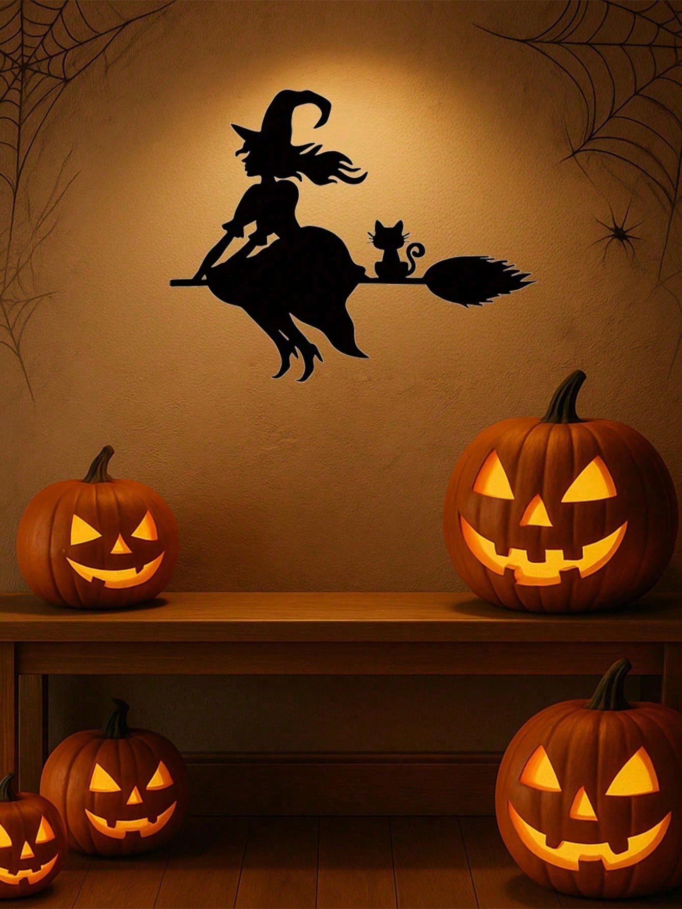 Midnight Witch Wall Art: An intricately crafted iron silhouette of a witch soaring on a broomstick under the moonlight. This Halloween-themed black metal wall ornament features delicate butterfly accents, adding a mystical charm to your space. Perfect as
