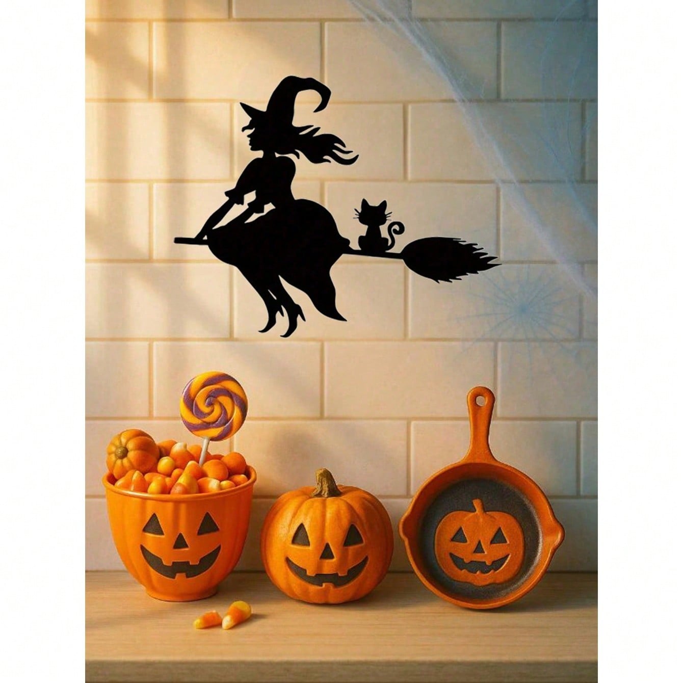 Midnight Witch Wall Art: An intricately crafted iron silhouette of a witch soaring on a broomstick under the moonlight. This Halloween-themed black metal wall ornament features delicate butterfly accents, adding a mystical charm to your space. Perfect as