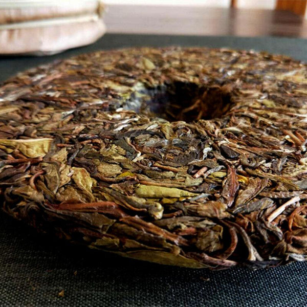 357g Pu'er raw tea golden leaves golden Mengku yellow slices, seven seed cakes