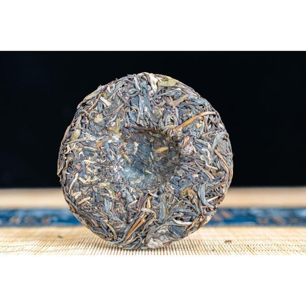 100g Pu'er Raw Tea Iceland Yunnan Ancient Tea Spring Tea Cake Orchid Fragrance