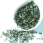 Close-up view of high-quality Biluochun green tea loose leaves showing fresh spring harvested tea leaves and natural texture