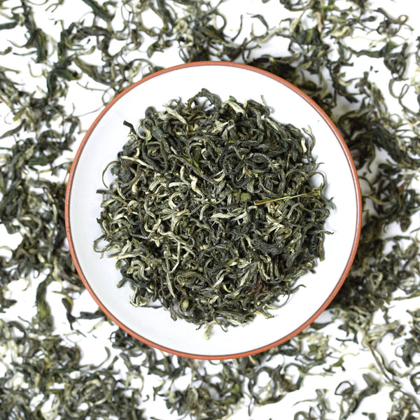 Close-up of HelloYoung Tea Biluochun green tea packaging showing premium loose leaf Chinese green tea details