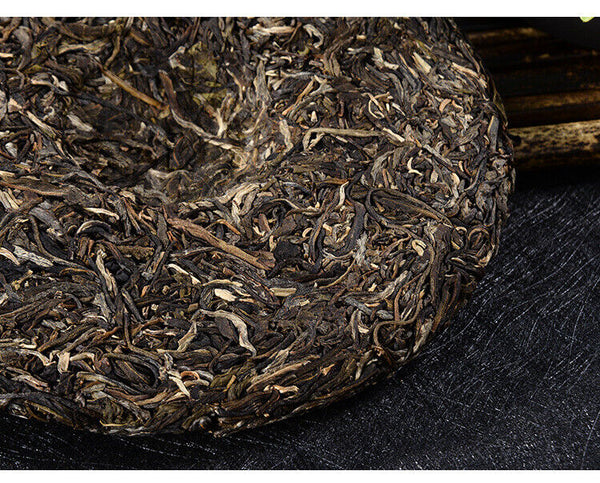 Detailed view of the pressed raw Pu-erh tea leaves, showing the natural texture and high-quality Arbor King ingredients.